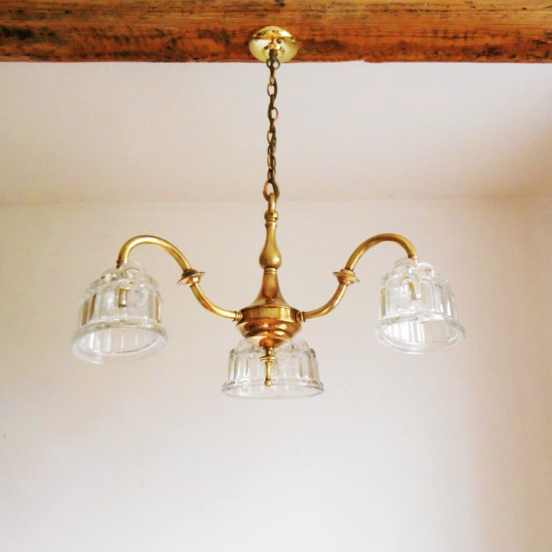 Brass chandelier with jelly mould shades by Fiona Bradshaw Designs