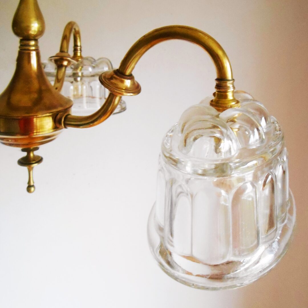 Brass chandelier with jelly mould shades by Fiona Bradshaw Designs