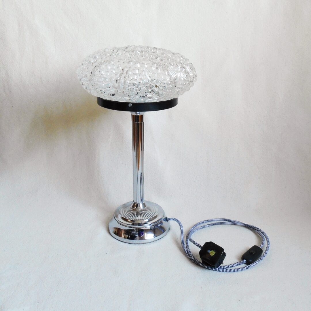 A bubble glass table lamp with a silver chrome base and stem by Fiona Bradshaw Designs