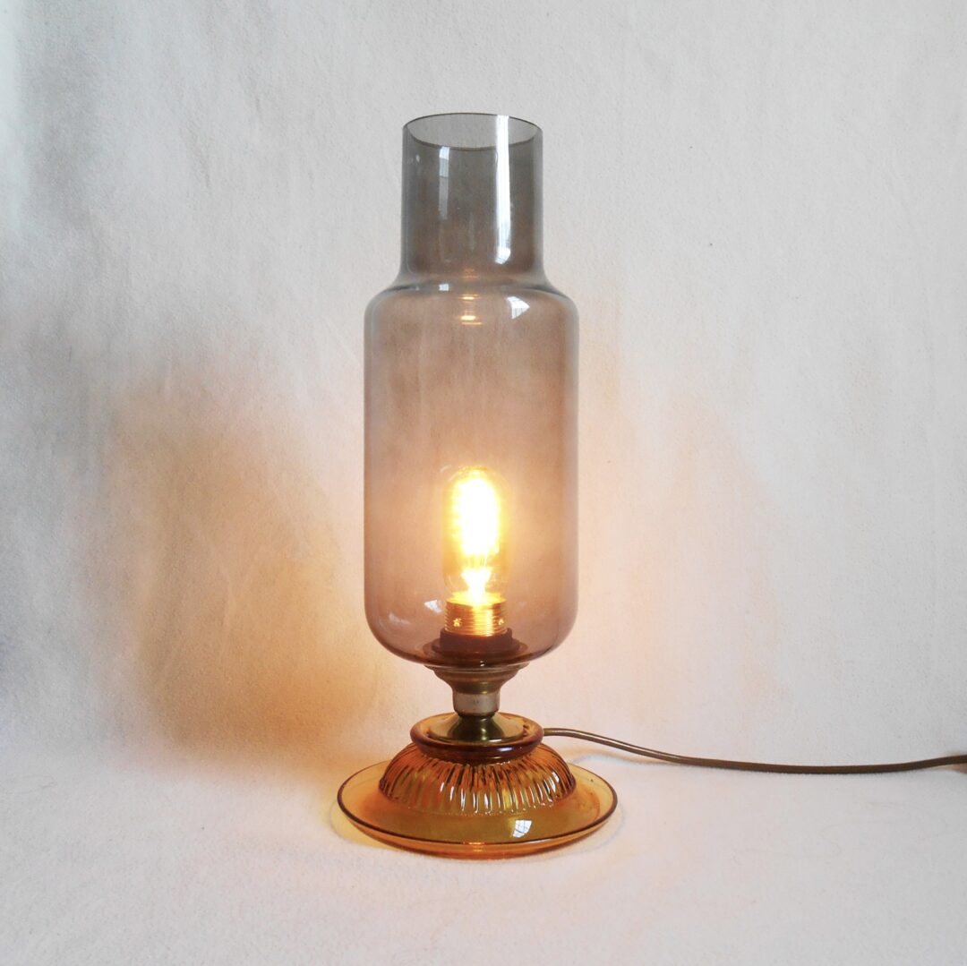 A mid century modern smoked glass table lamp by Fiona Bradshaw Designs