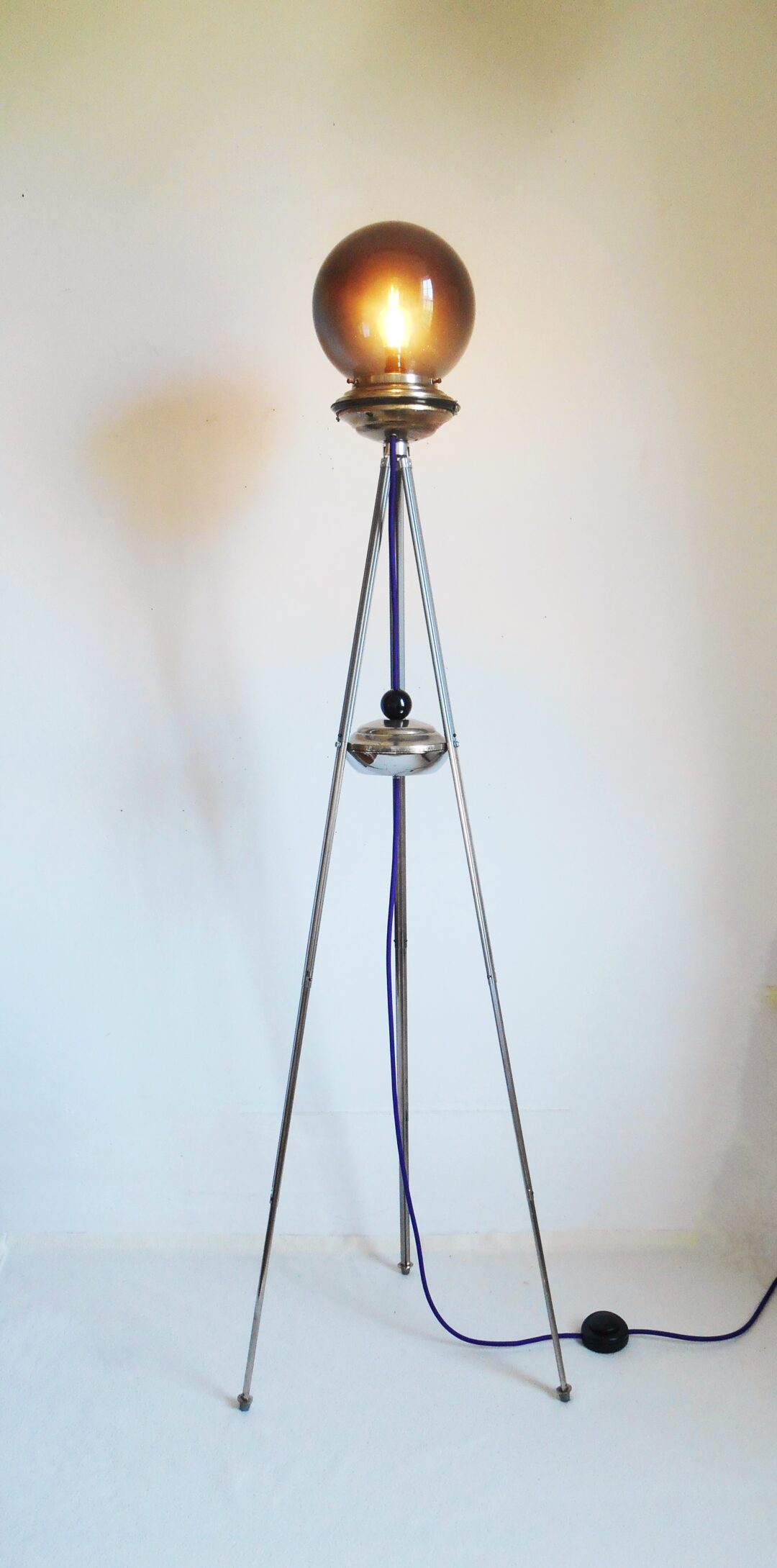 A repurposed tripod lamp with a vintage dark glass shade by Fiona Bradshaw Designs