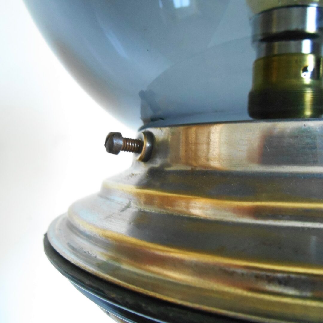 A repurposed tripod lamp with a vintage dark glass shade by Fiona Bradshaw Designs