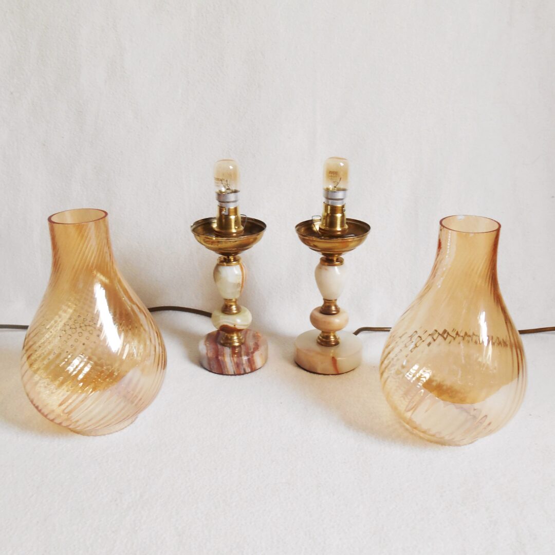 A pair of brass and onyx bedside lamps by Fiona Bradshaw Designs