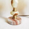 A pair of brass and onyx bedside lamps by Fiona Bradshaw Designs
