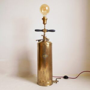 A brass antique garden sprayer floor lamp by Fiona Bradshaw Designs