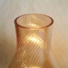 A pair of brass and onyx bedside lamps by Fiona Bradshaw Designs
