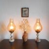 A pair of brass and onyx bedside lamps by Fiona Bradshaw Designs