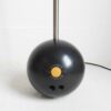 A bowling ball floor lamp with a gorgeous mid century modern amber glass shade by Fiona Bradshaw Designs