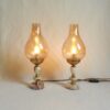 A pair of brass and onyx bedside lamps by Fiona Bradshaw Designs