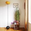 A bowling ball floor lamp with a gorgeous mid century modern amber glass shade by Fiona Bradshaw Designs