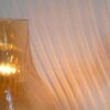 A pair of brass and onyx bedside lamps by Fiona Bradshaw Designs