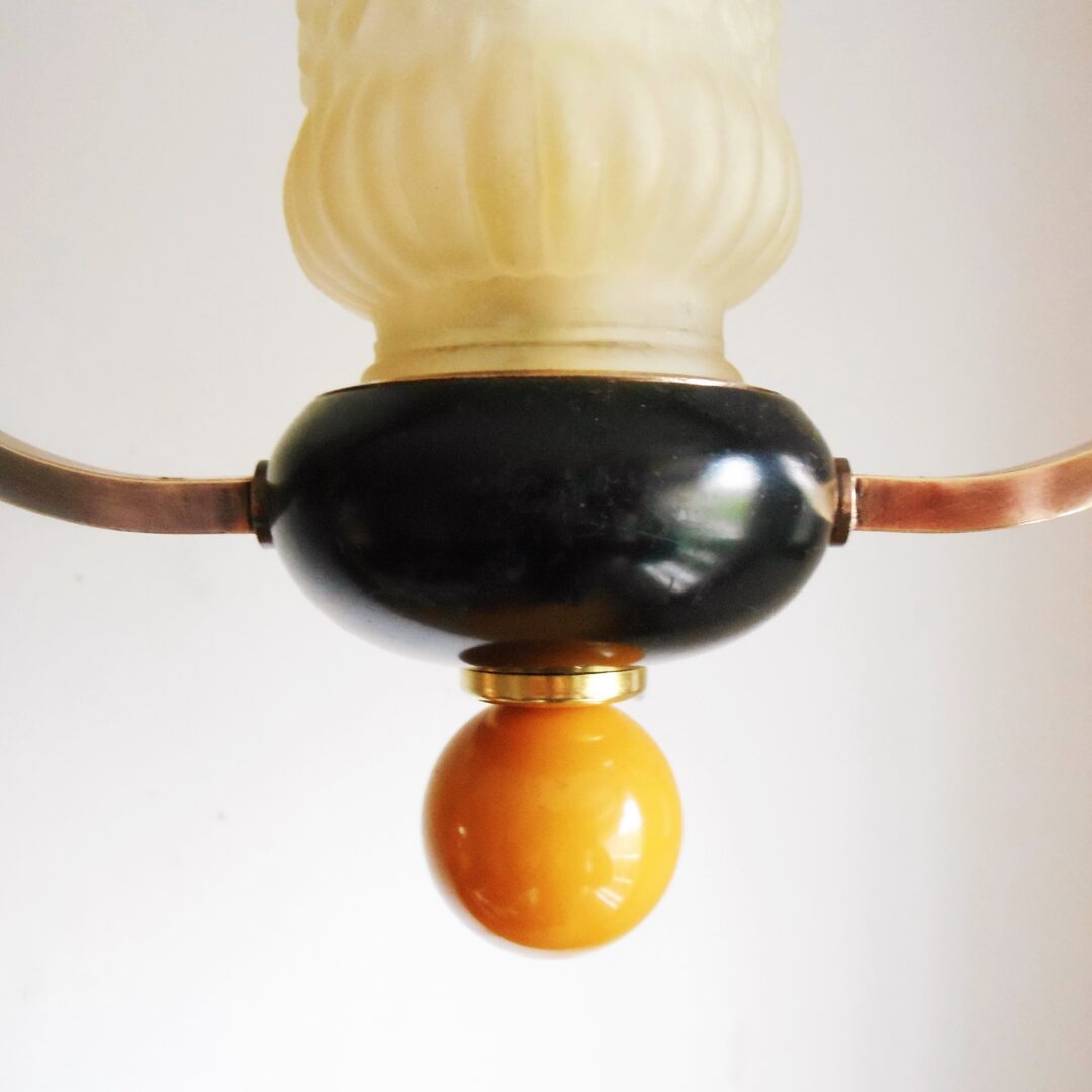 A pair of unique copper pendant lamps by Fiona Bradshaw Designs