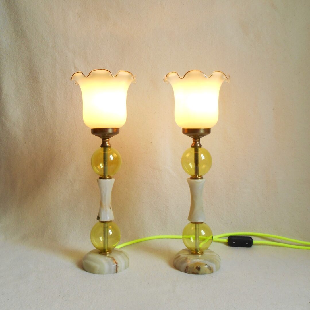 A pair of lime marble table lamps with neon yellow cables by Fiona Bradshaw Designs.