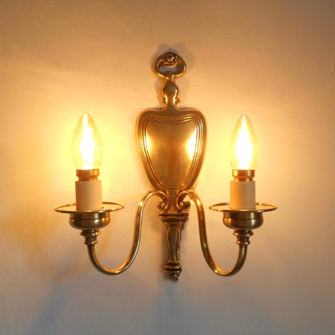 A pair of antique solid brass wall lamps by Fiona Bradshaw Designs