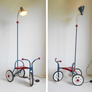 A vintage tricycle repurposed into a floor lamp by Fiona Bradshaw Designs
