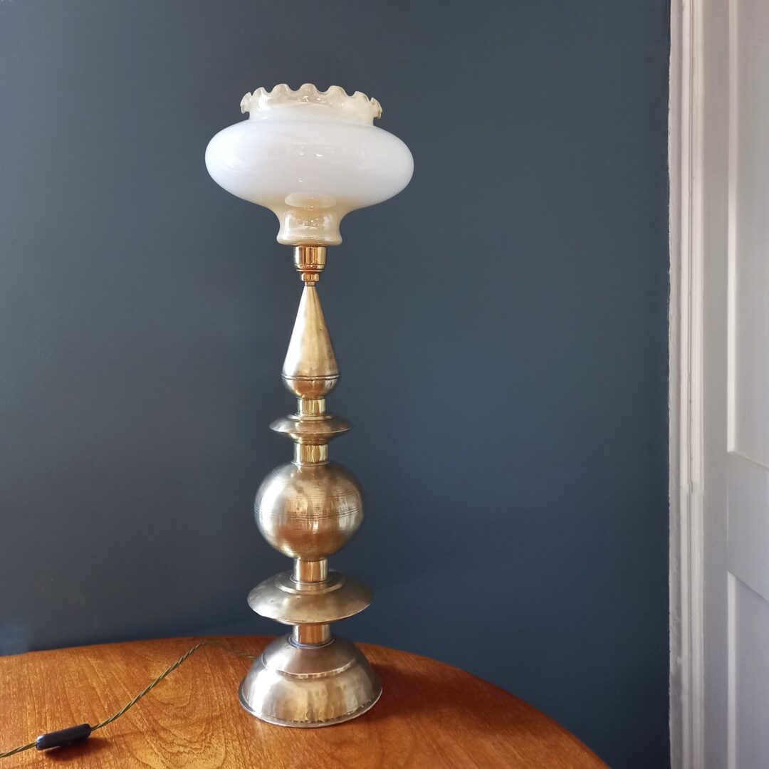 A brass rocket table lamp with a pearly glass shade by Fiona Bradshaw Designs