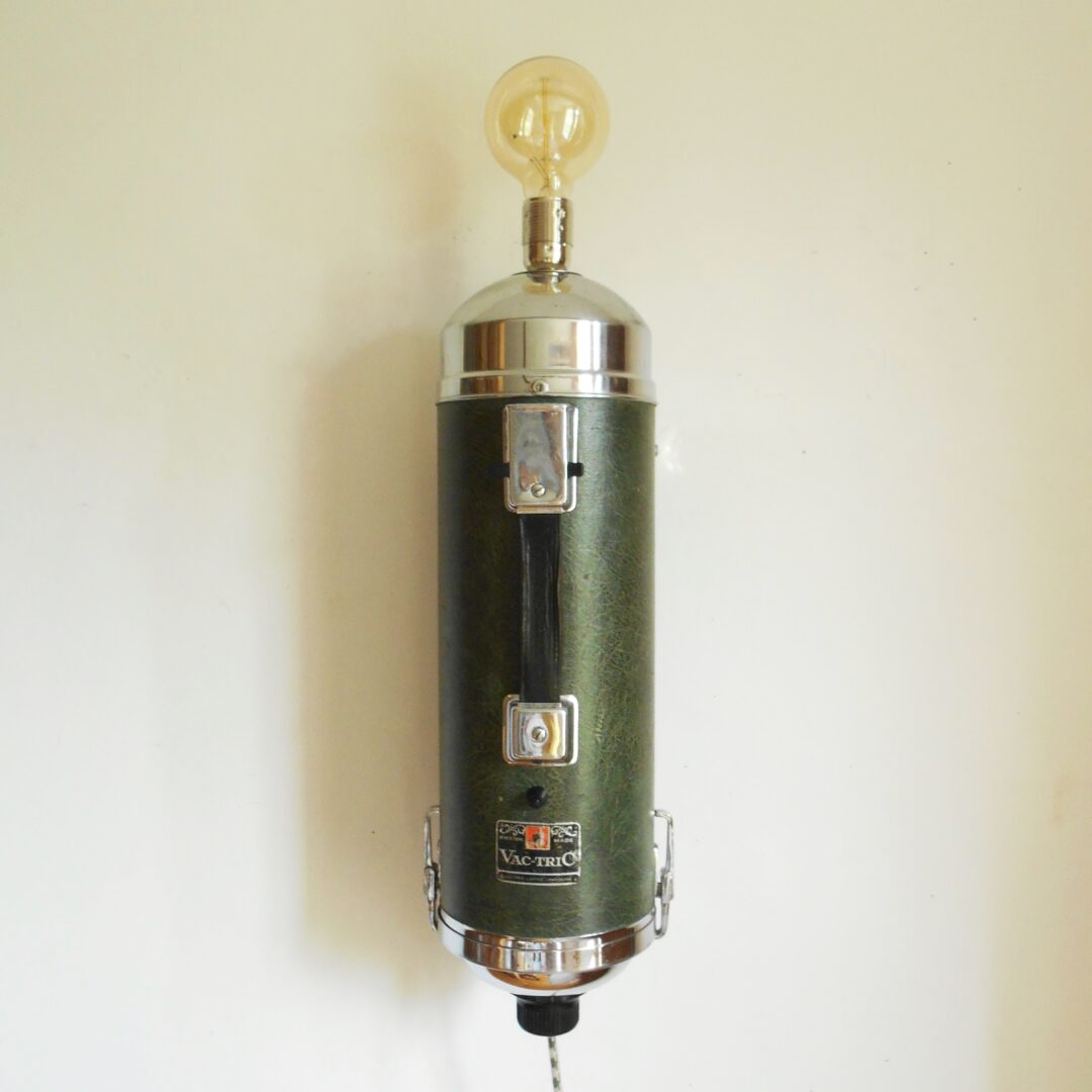 A 1930’s vacuum repurposed into a unique wall lamp by Fiona Bradshaw Designs
