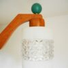 A mid century modern teak chandelier with unique retro features by Fiona Bradshaw Designs