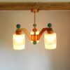 A mid century modern teak chandelier with unique retro features by Fiona Bradshaw Designs