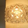 A mid century modern teak chandelier with unique retro features by Fiona Bradshaw Designs