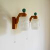 A pair of unique mid century modern teak wall lamps by Fiona Bradshaw Designs