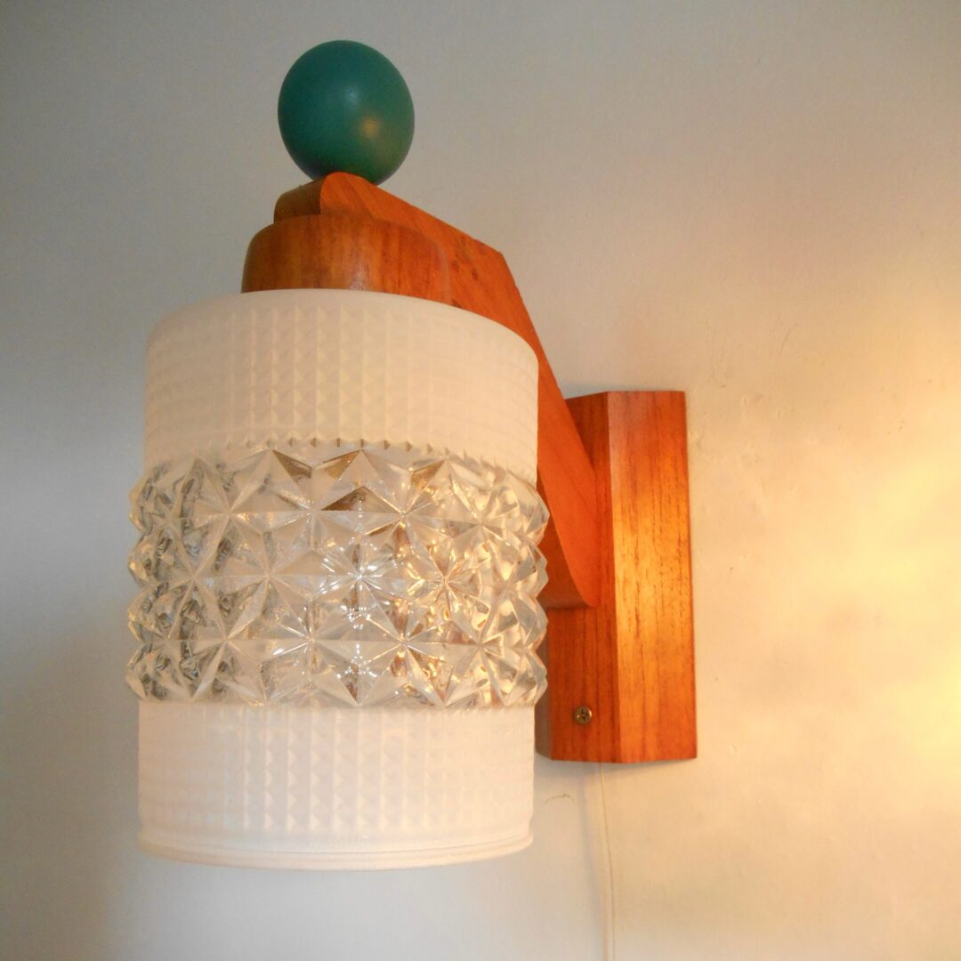 A pair of unique mid century modern teak wall lamps by Fiona Bradshaw Designs