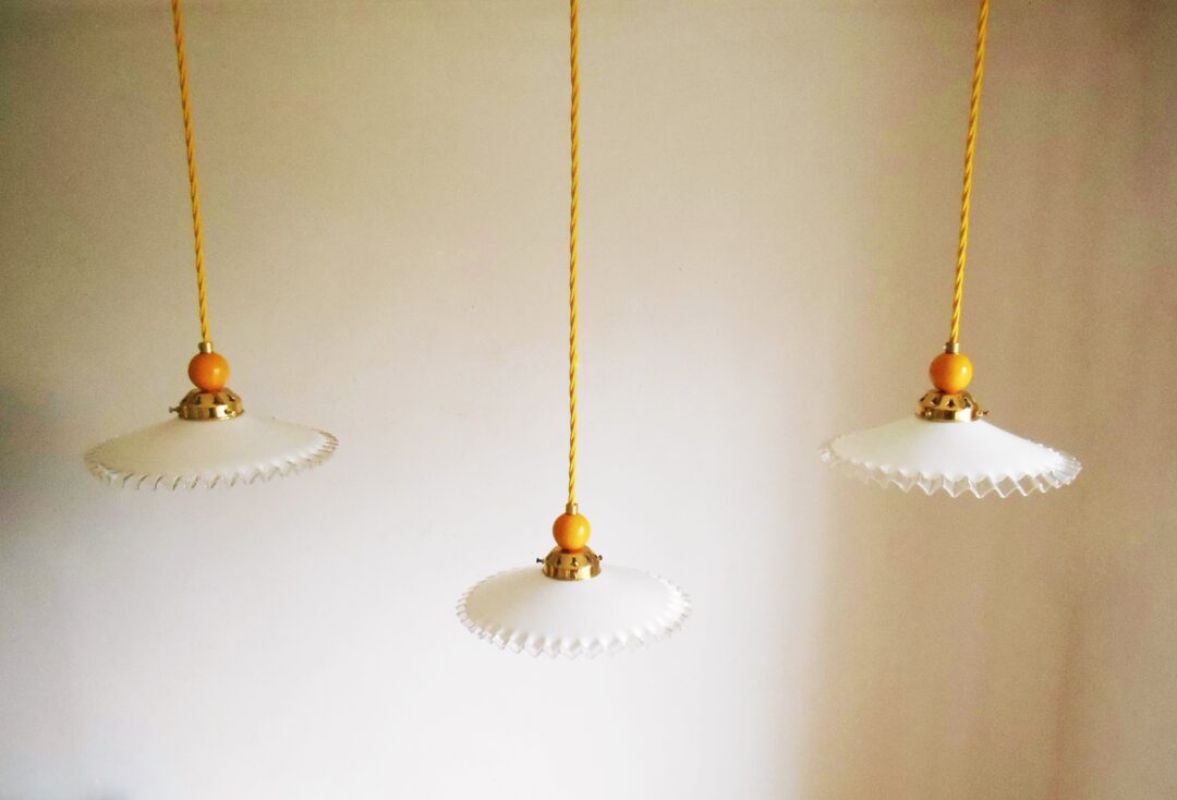 A trio of French antique opaline glass pendant lamps by Fiona Bradshaw Designs