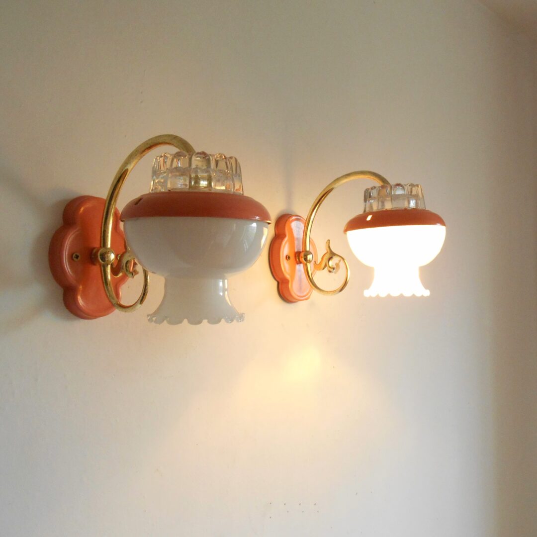 A pair of retro style pink wall lamps by Fiona Bradshaw Designs