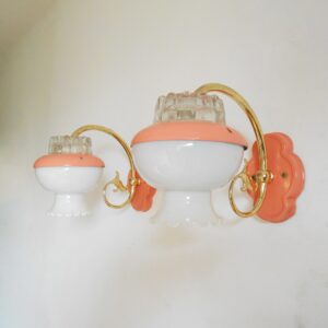 A pair of retro style pink wall lamps by Fiona Bradshaw Designs