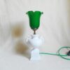 A ceramic white table lamp with a green glass shade by Fiona Bradshaw Designs