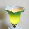 A ceramic white table lamp with a green glass shade by Fiona Bradshaw Designs