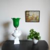 A ceramic white table lamp with a green glass shade by Fiona Bradshaw Designs