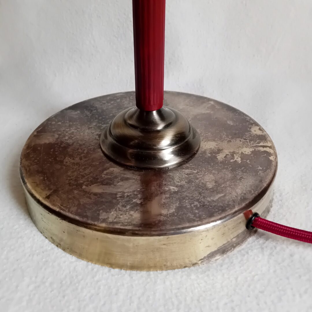 A burgundy glass cowl table lamp by Fiona Bradshaw Designs