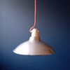A pair of industrial pendant lamps by Fiona Bradshaw Designs