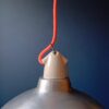 A pair of industrial pendant lamps by Fiona Bradshaw Designs