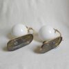 A pair of Art Deco style wall lamps with glass globe shades by Fiona Bradshaw Designs