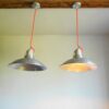 A pair of industrial pendant lamps by Fiona Bradshaw Designs