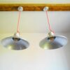 A pair of industrial pendant lamps by Fiona Bradshaw Designs