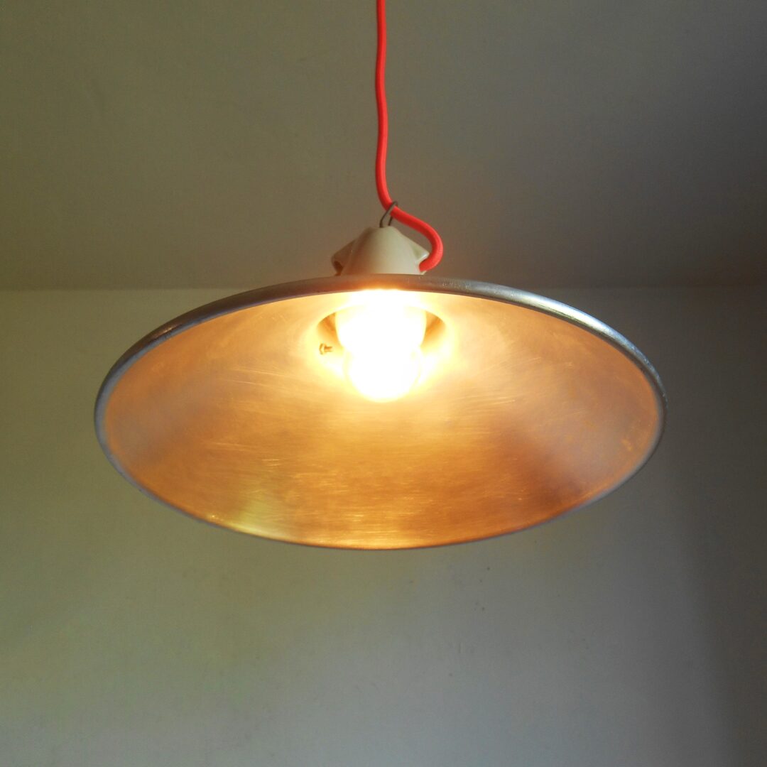 A pair of industrial pendant lamps by Fiona Bradshaw Designs