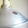 A pair of industrial pendant lamps by Fiona Bradshaw Designs