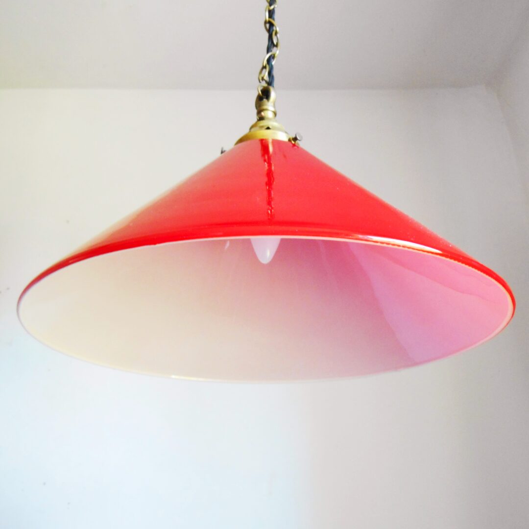 A pair of red pendant lamps by Fiona Bradshaw Designs