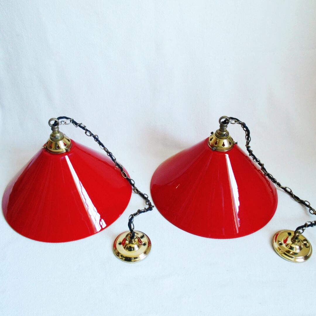 A pair of red pendant lamps by Fiona Bradshaw Designs