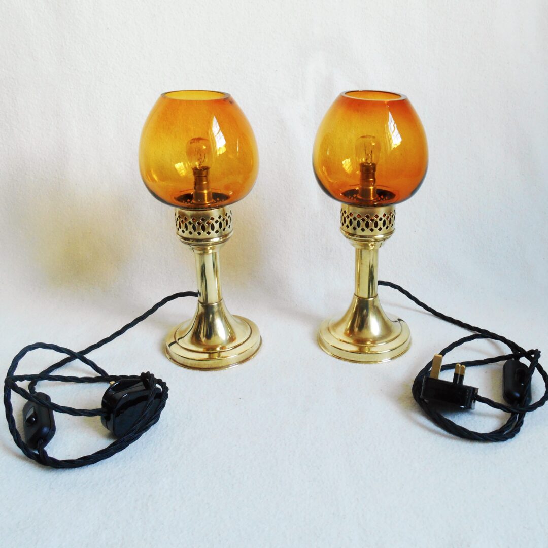 A pair of antique brass table lamps by Fiona Bradshaw Designs