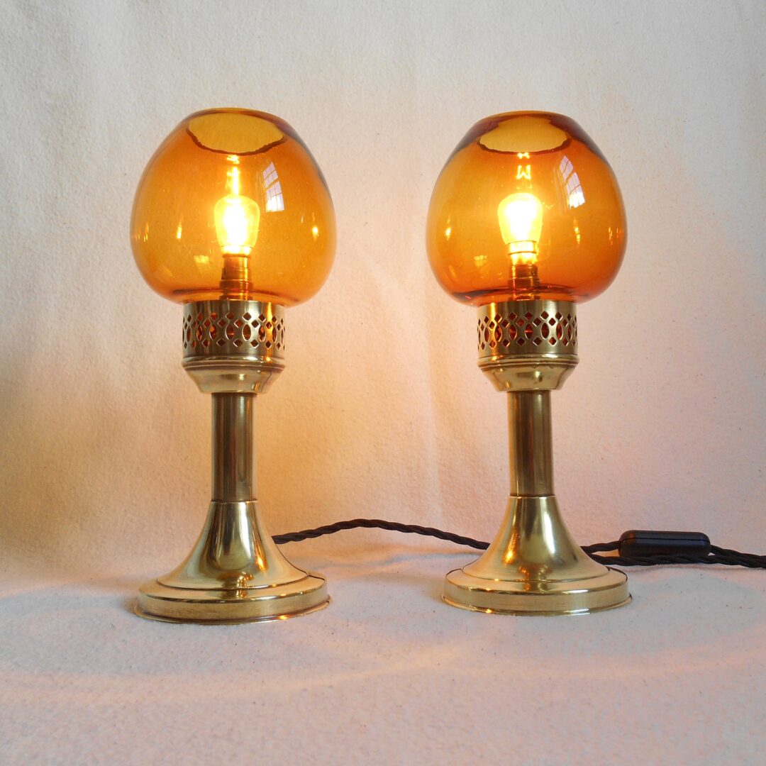 A pair of antique brass table lamps by Fiona Bradshaw Designs