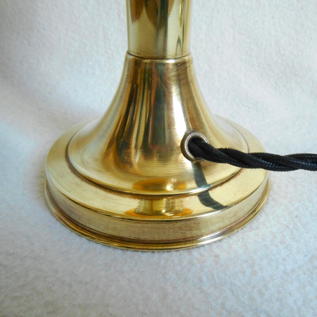 A pair of antique brass table lamps by Fiona Bradshaw Designs