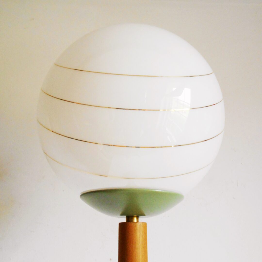 A mid century modern teak floor lamp by Fiona Bradshaw Designs