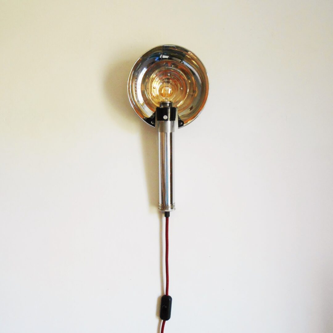 A retro camera flash converted into a wall lamp by Fiona Bradshaw Designs