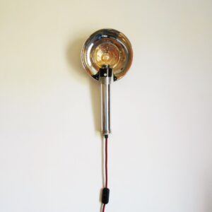 A retro camera flash converted into a wall lamp by Fiona Bradshaw Designs