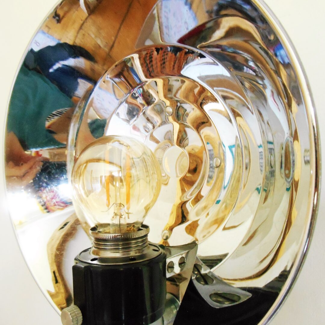 A retro camera flash converted into a wall lamp by Fiona Bradshaw Designs