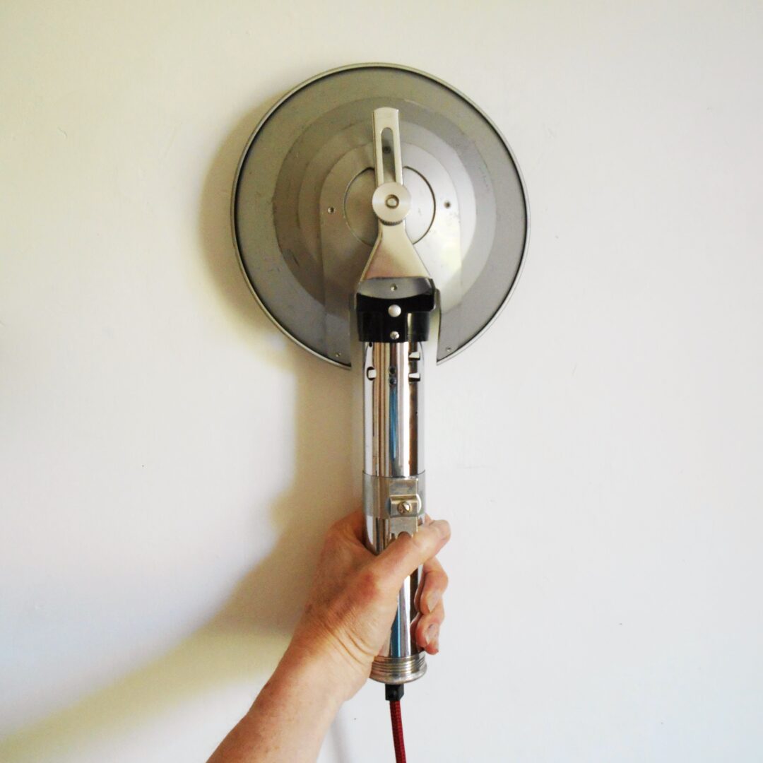 A retro camera flash converted into a wall lamp by Fiona Bradshaw Designs